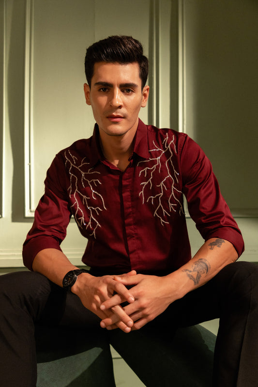SILVER LIGHT EMBROIDERED ON A MAROON SHIRT