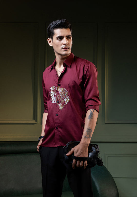 ROARING TIGER EMBROIDERED ON A MAROON SHIRT