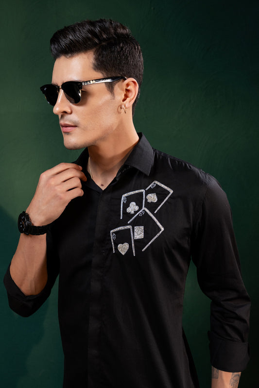 ACES EMBROIDERED ON A BLACK SHIRT