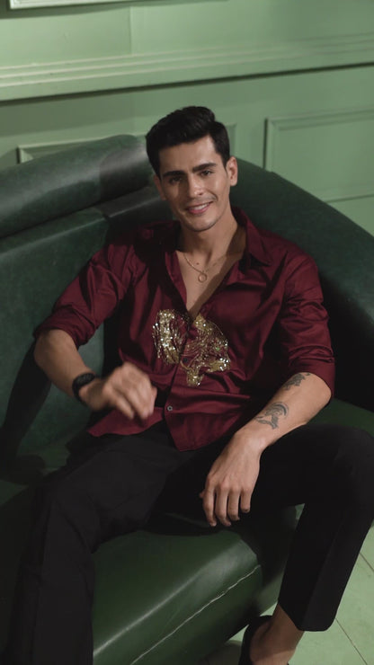 "ROARING TIGER" EMBROIDERED ON A MAROON SHIRT