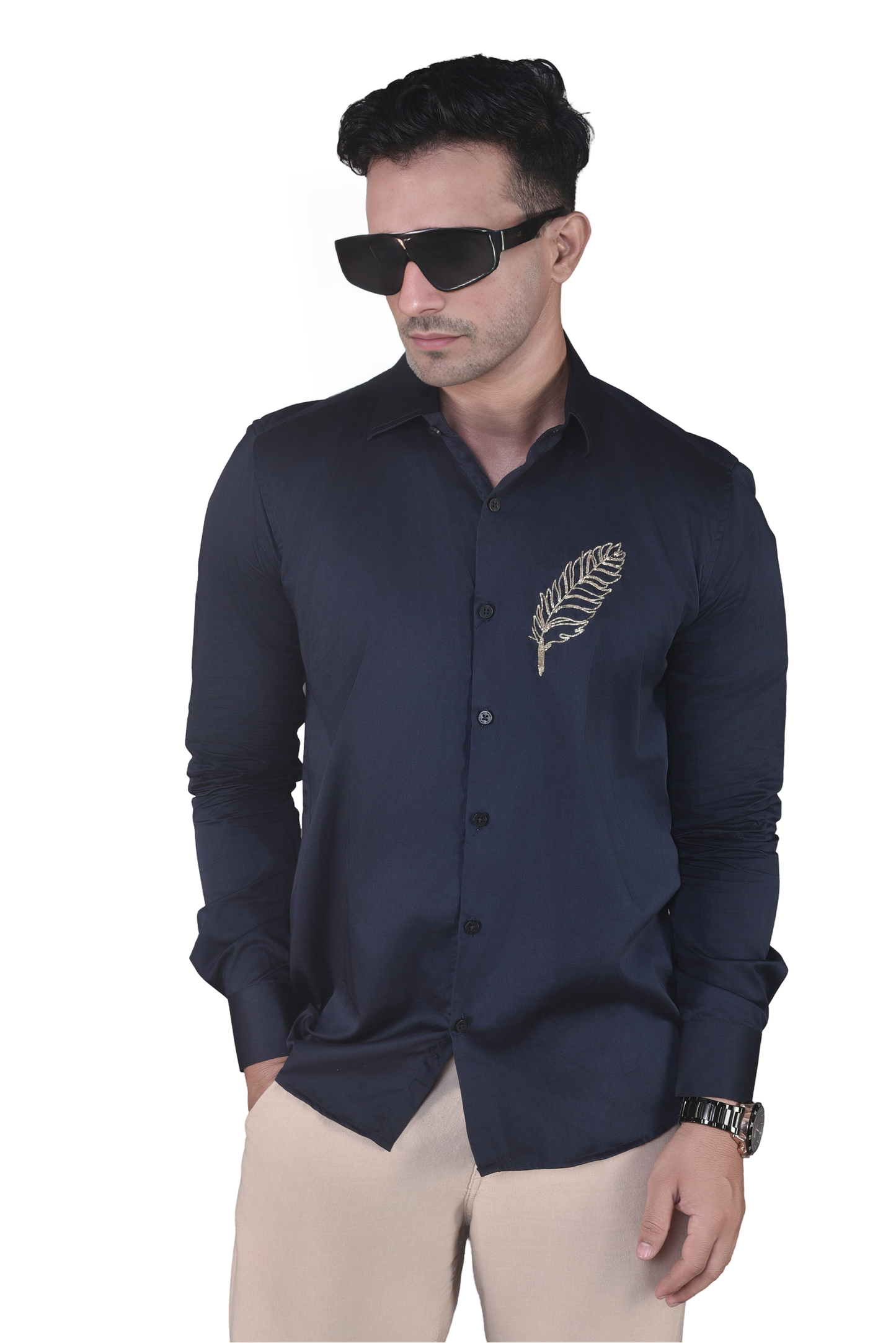 FEATHER EMBROIDERED ON A NAVY BLUE SHIRT